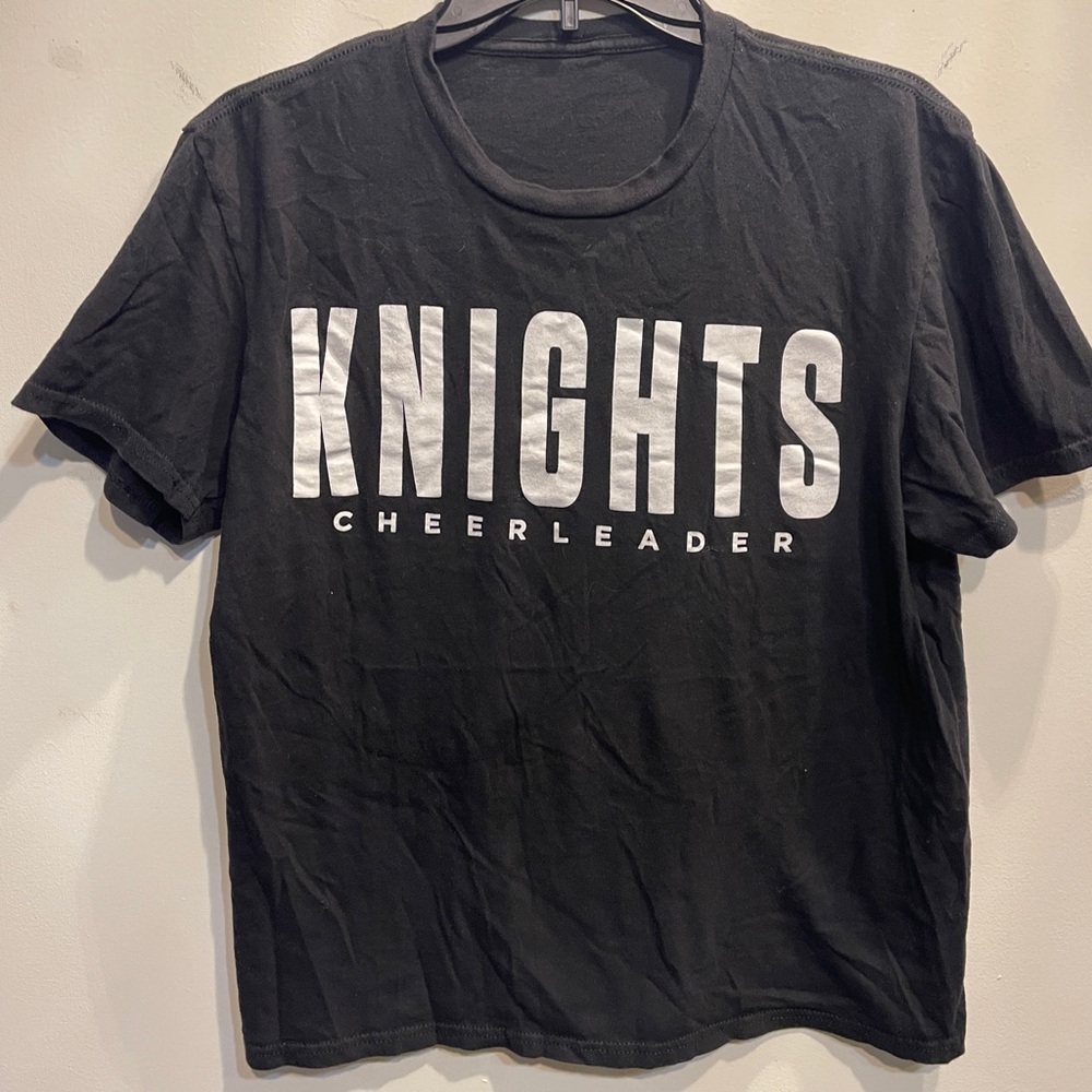 Black Knights Cheerleader T-Shirt, no tag for shirt, the size listed is correct.